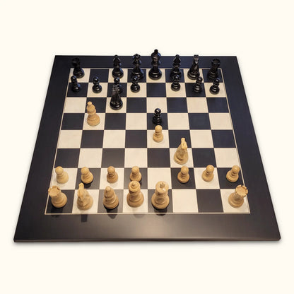 Chess pieces American Staunton ebonized on black deluxe chessboard top