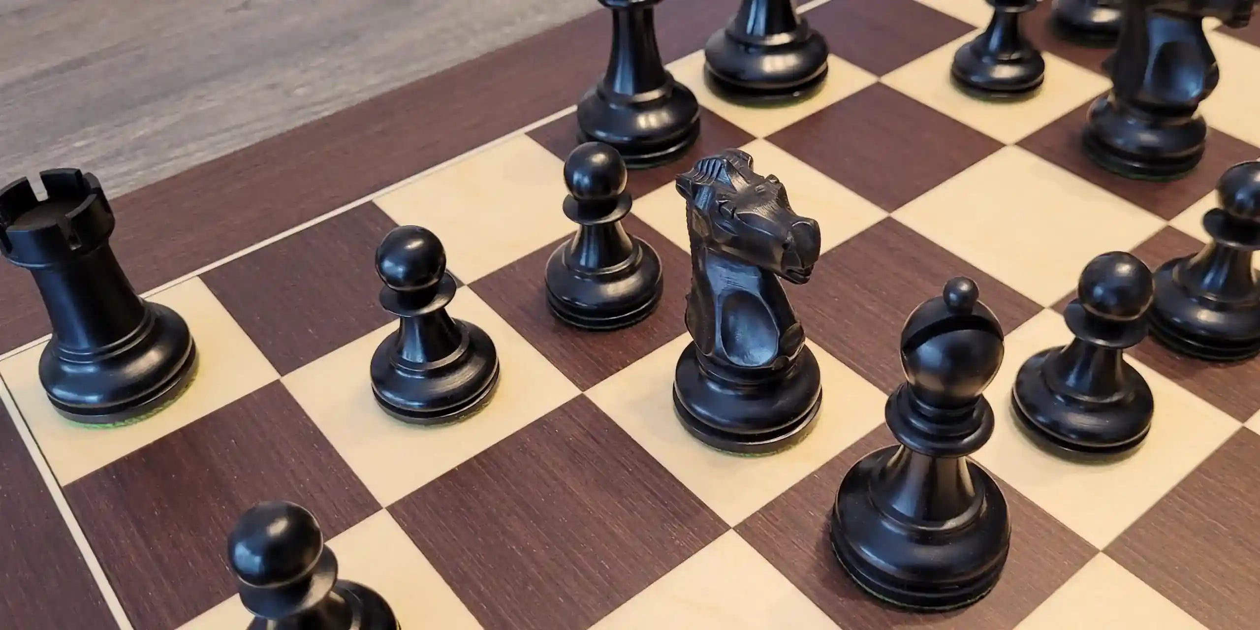 Fischer chess pieces on wenge chess board