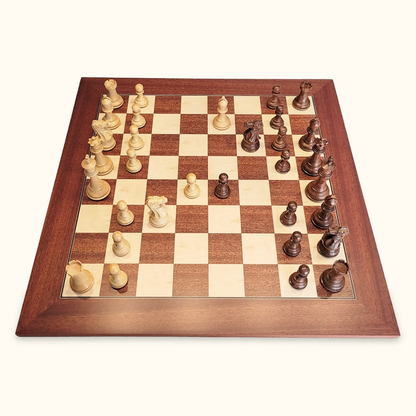 Chess pieces stallion knight acacia on mahogany chessboard side