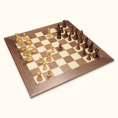 Chess pieces kings bridal acacia on walnut chessboard diagonal