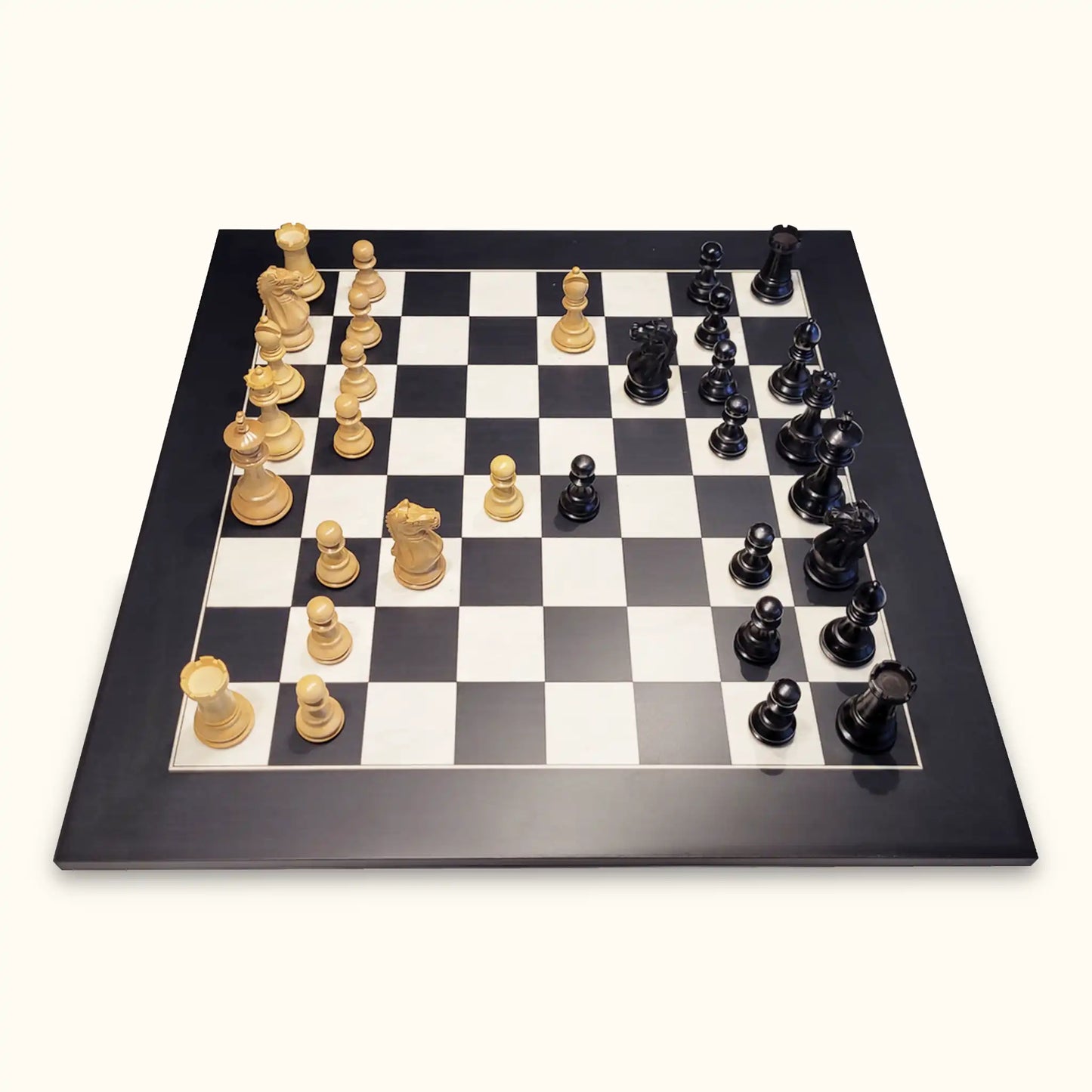 Chess pieces oxford ebonised on walnut chessboard side